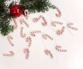 candy cane garland beside tree branches