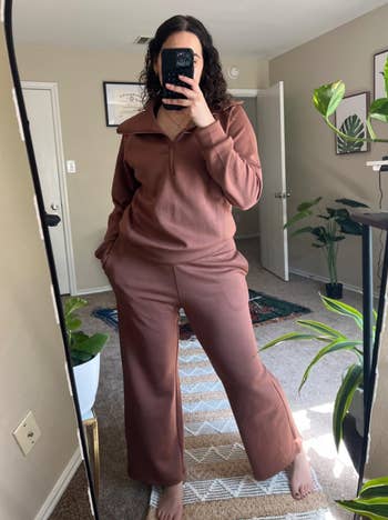 reviewer taking a reflector selfie wearing the acceptable successful brown