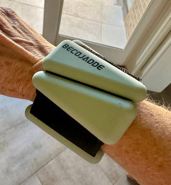 the green weight on a wrist