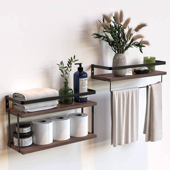 a two-tier shelf and a one-tier shelf with a towel bar holding various bathroom products