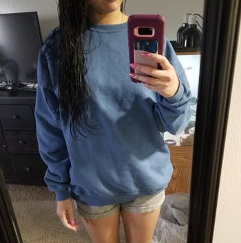 reviewer in blue version of the sweatshirt 