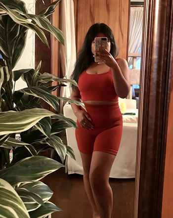 reviewer wearing the red set