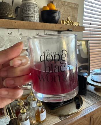 Person holding a solid  mug with 