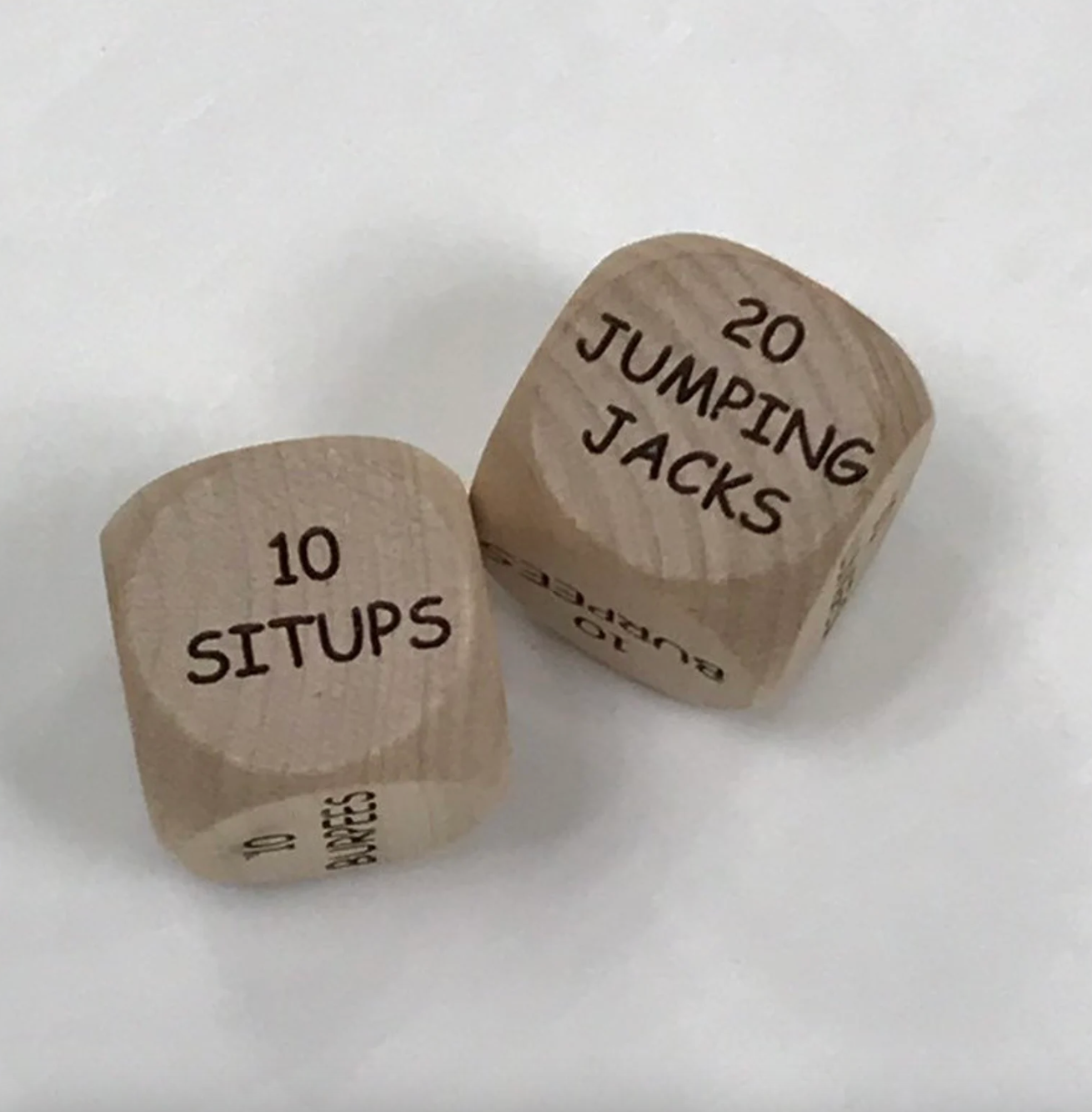 wooden dice that say 