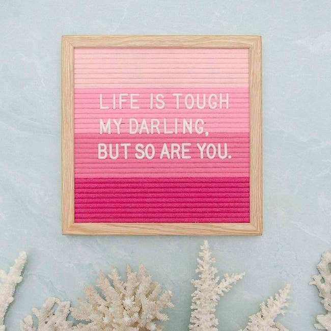 the pink ombre letter board with white letters spelling out an encouraging quote
