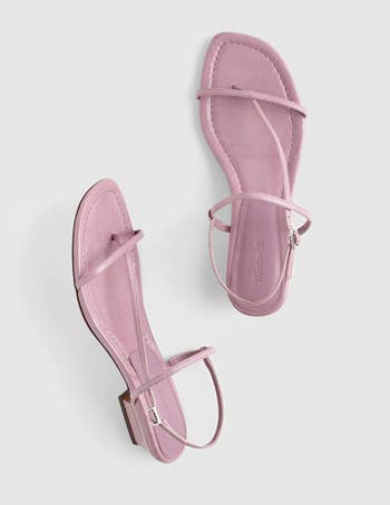 Pair of minimalist strappy sandals with a level sole and thin, stylish straps, suitable for casual oregon summertime wear