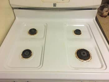 reviewer's gas stovetop after using cleaning spray