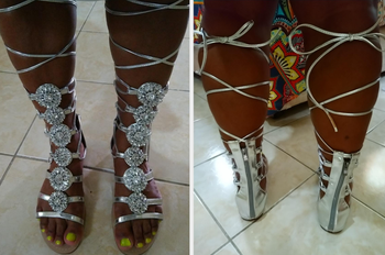 Reviewer wearing knee-high silver gemstone gladiator sandals, back view of reviewer wearing product