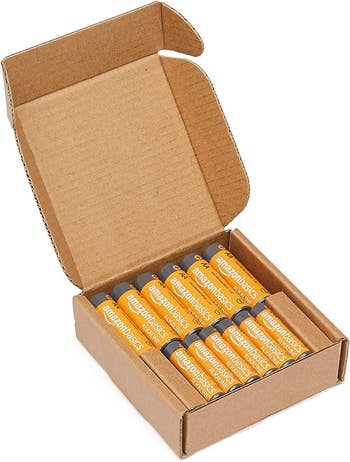 An opened box filled with batteries 