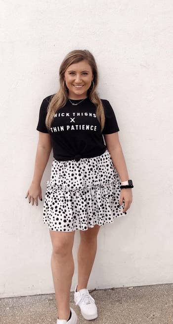 Reviewer wearing black and white skirt