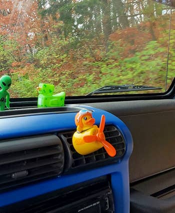a duck pilot air freshener in a car