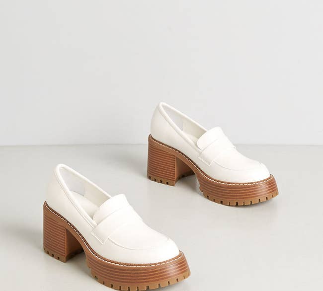white loafers with brown stacked heels and platform soles