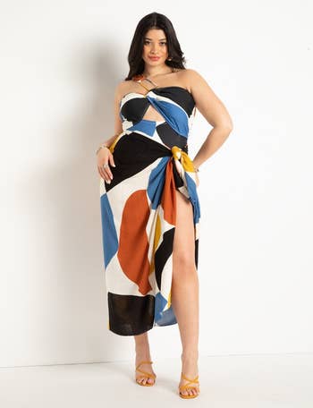 model wearing skirt with red black blue and yellow print