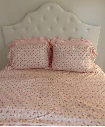 a reviewer's bed with floral sheets