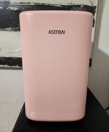 AstroAI pink mini fridge on a counter