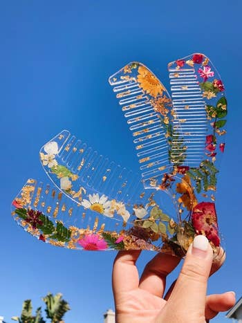 Reviewer photo of combs they made using the dried flowers and leaves