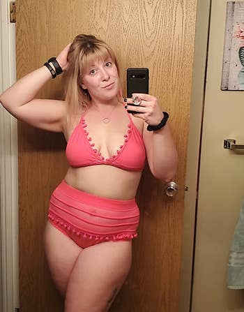 a reviewer wearing the bikini in pink 