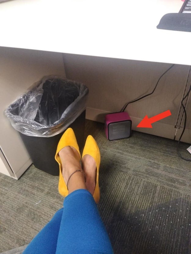 a reviewer using the pink heater under their desk
