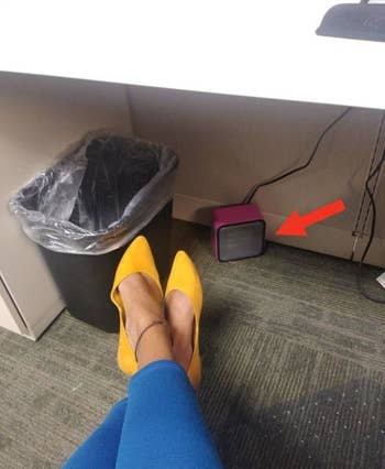 a reviewer using the pink heater under their desk