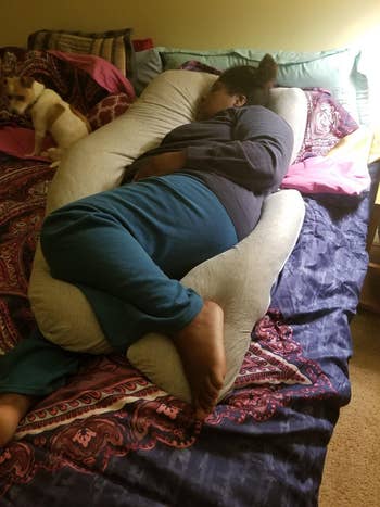 Reviewer laying connected  airy  grey  pillow