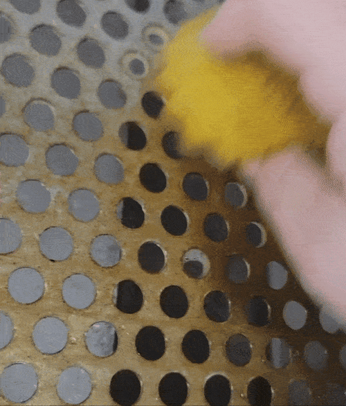 A gif of a reviewer scrubbing a grate