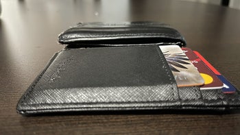 reviewer photo of slim black wallet, compared to other wallet