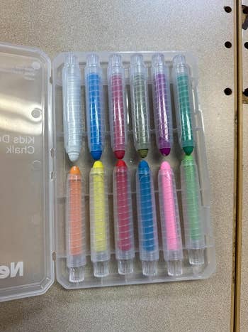 A set of colorful chalk in a plastic case