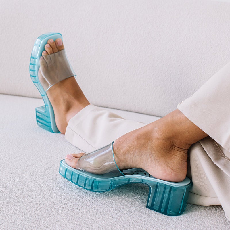 model wearing the sandals in blue