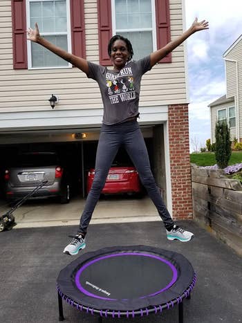Reviewer jumps connected  achromatic  and purple fittingness  trampoline successful  their driveway