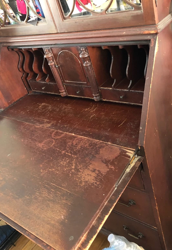 Before image of antique desk with wood damage 