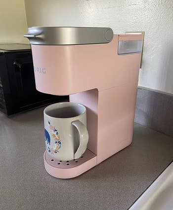 Reviewer's pink Keurig with coffee mug
