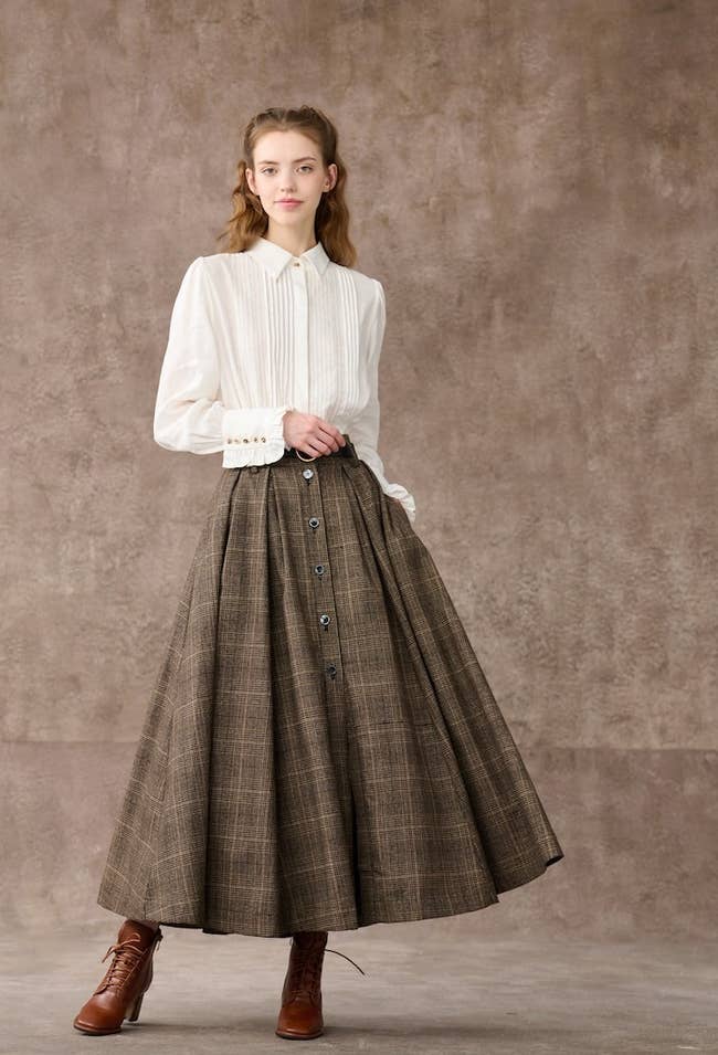 model wearing the plaid skirt