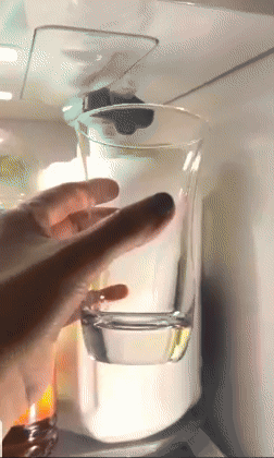 reviewer's finger pressing the dispenser on a milk jug 