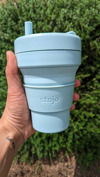a light blue stojo cup