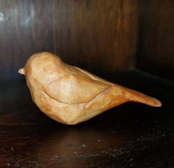 A freshly carved wooden bird