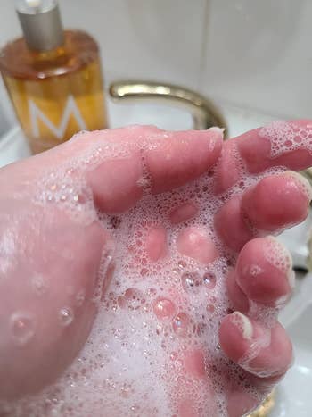 Reviewer showing soap suds on hand