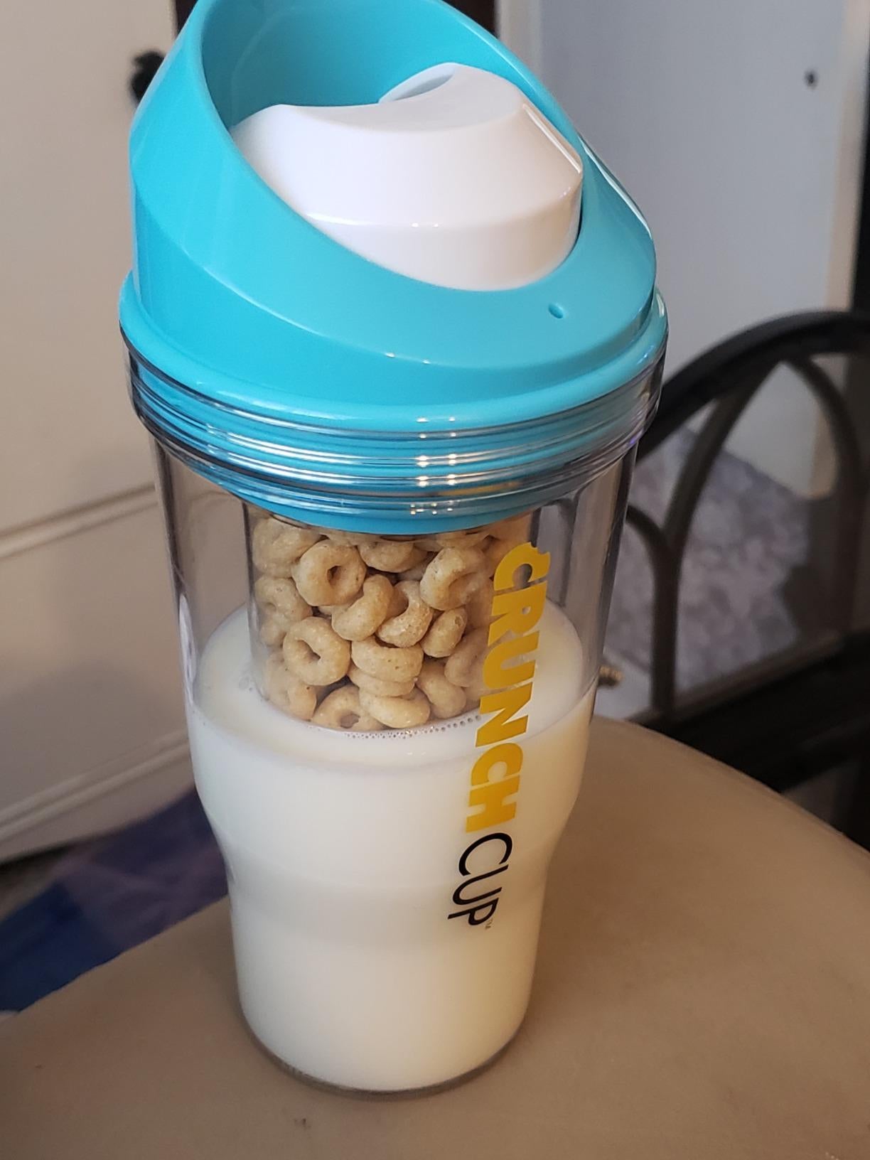 reviewer image of the blue crunchcup filled with cereal and milk
