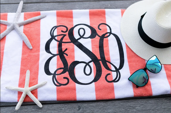 Image of peach and white towel with monogram
