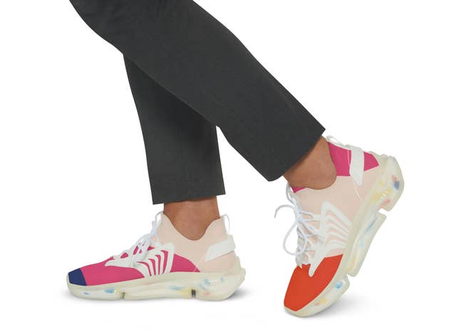 the blue, hot pink, and orange sneakers with laces across the top