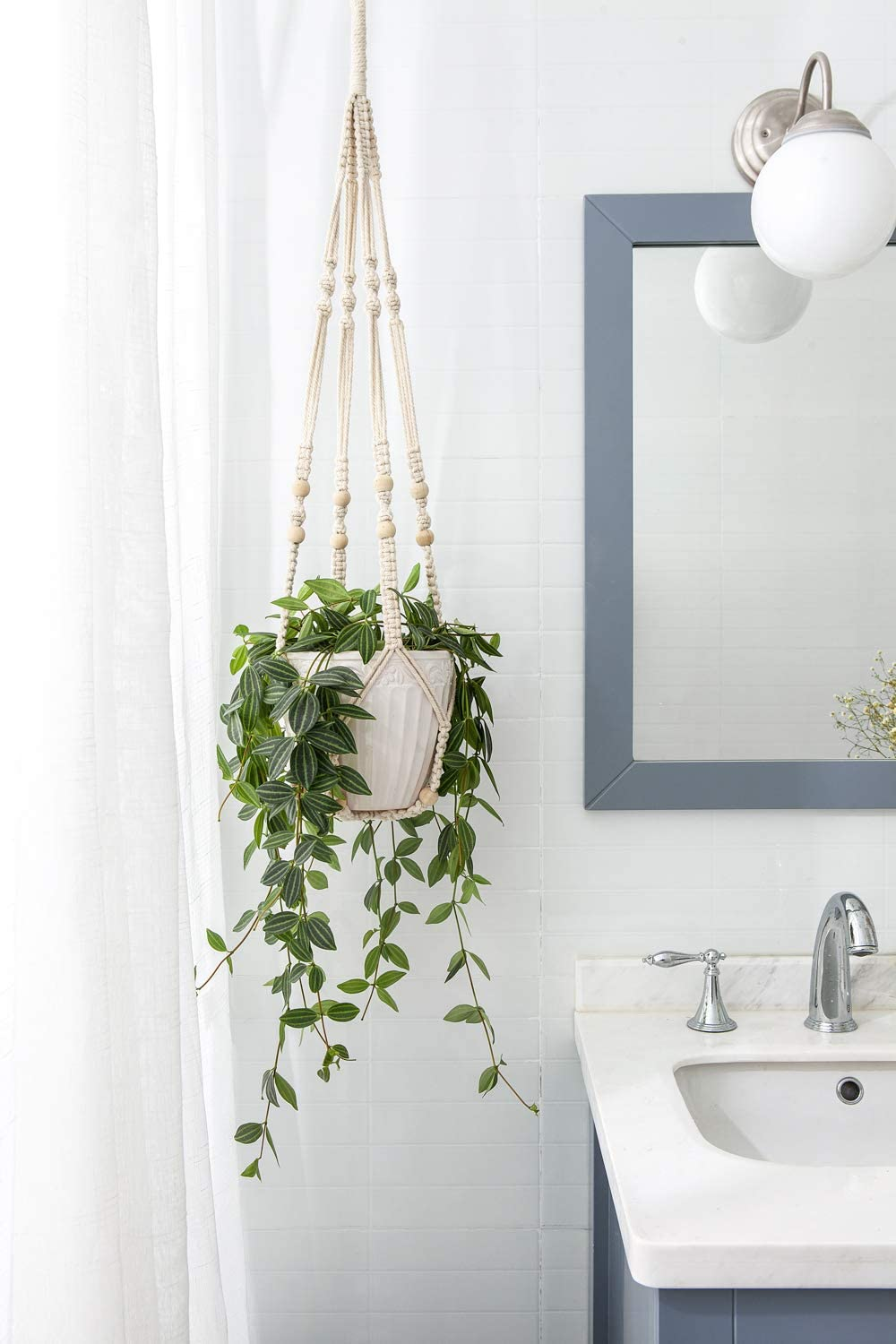 the white plant hanger hanging in a bathroom