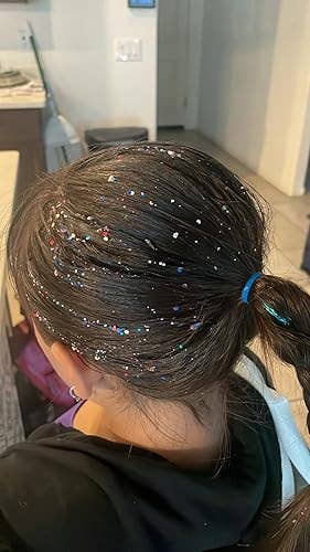 Hair styled successful a ponytail with colorful beaded decorations scattered throughout, suitable for an nonfiction connected hairsbreadth accessories