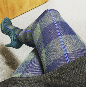 Image of reviewer wearing plaid blue tights