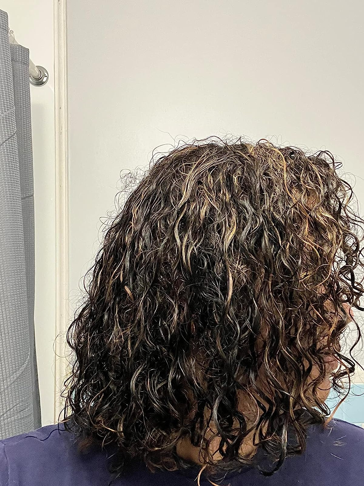 image of reviewer with wet, wavy hair