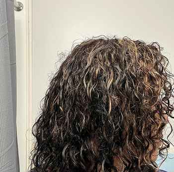image of reviewer with wet, wavy hair