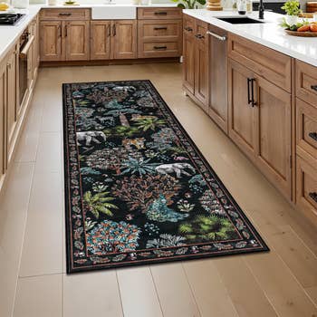 Kitchen with wood   cabinets featuring a agelong  runner rug adorned with intricate wildlife and works  patterns