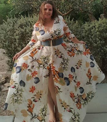 reviewer wearing the white floral print dress