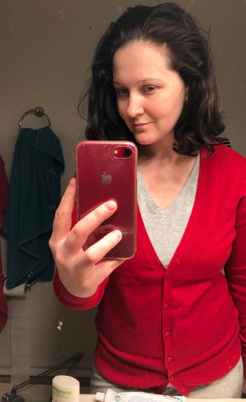 a reviewer wearing the cardigan in red 