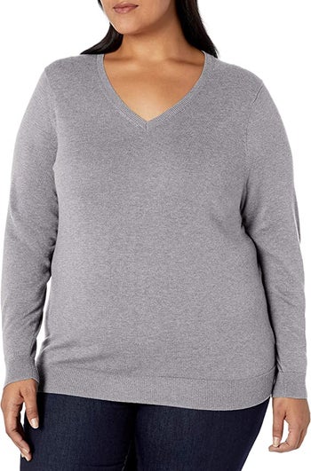 model wearing the light gray heather sweater