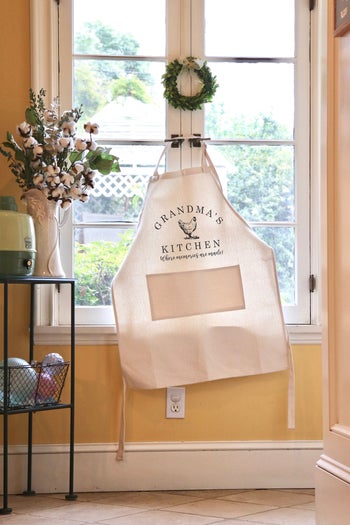 Grandma's Kitchen apron backlit against kitchen window