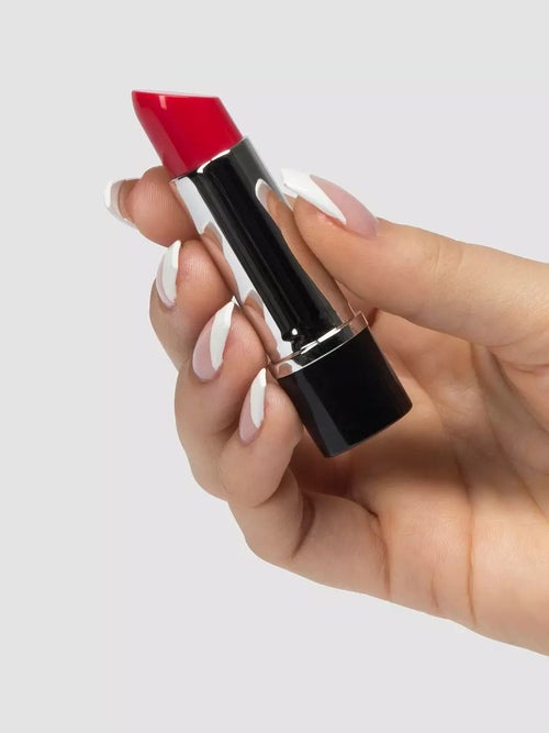 Model holding red lipstick vibrator